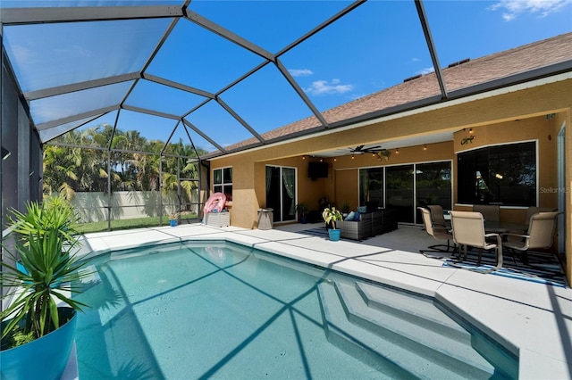 view of swimming pool with a fenced in pool, a ceiling fan, a patio area, glass enclosure, and fence