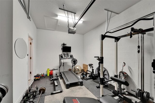 workout room with a textured ceiling