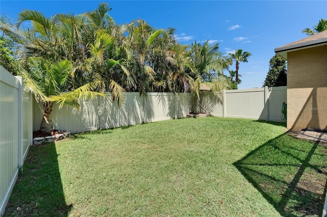 view of yard with a fenced backyard