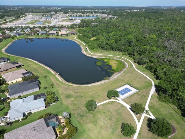 birds eye view of property with a wooded view, a residential view, and a water view