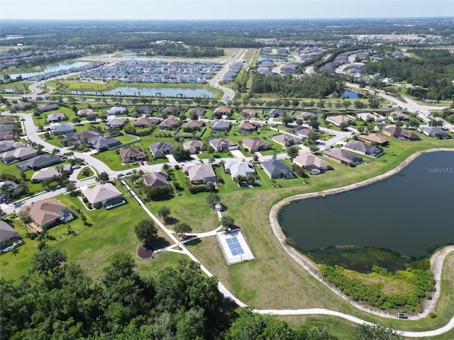birds eye view of property featuring a water view and a residential view