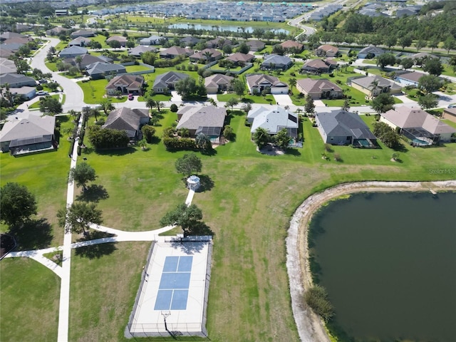 birds eye view of property with a residential view and a water view