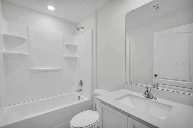 bathroom with visible vents, toilet, vanity, and shower / bathtub combination