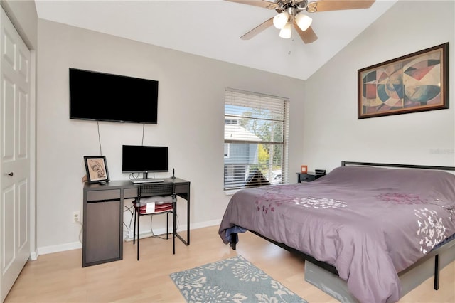200 Meres Blvd Unit 7, Tarpon Springs, FL 34689 - bedroom with wood finished floors, baseboards, vaulted ceiling, a closet, and ceiling fan