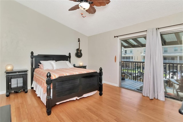 200 Meres Blvd Unit 7, Tarpon Springs, FL 34689 - bedroom with access to outside, light wood-type flooring, baseboards, ceiling fan, and vaulted ceiling