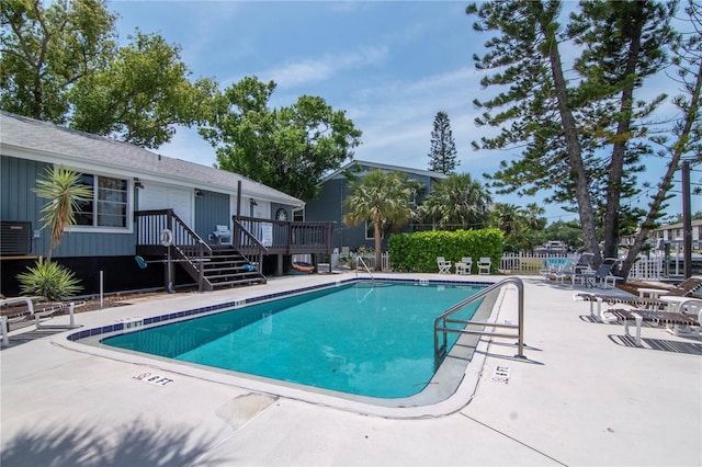 200 Meres Blvd Unit 7, Tarpon Springs, FL 34689 - community pool featuring fence, a patio area, a deck, and cooling unit