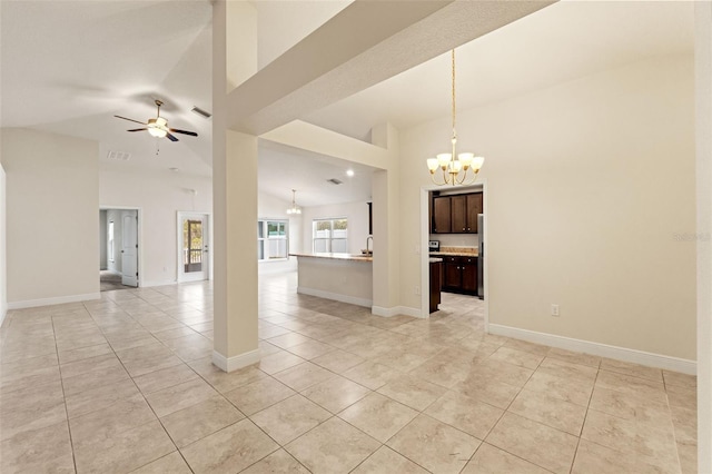 16302 Vine Cliff Ave, Hudson, FL 34667 - unfurnished living room with light tile patterned flooring, baseboards, high vaulted ceiling, and ceiling fan with notable chandelier