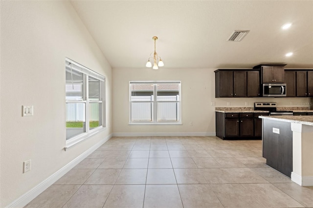 16302 Vine Cliff Ave, Hudson, FL 34667 - kitchen featuring a notable chandelier, dark brown cabinetry, appliances with stainless steel finishes, light tile patterned floors, and visible vents