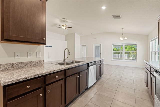 16302 Vine Cliff Ave, Hudson, FL 34667 - kitchen featuring light tile patterned floors, stainless steel appliances, a sink, a peninsula, and dark brown cabinetry