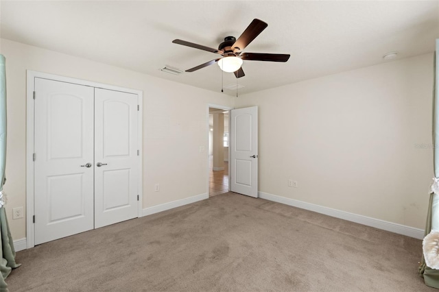 16302 Vine Cliff Ave, Hudson, FL 34667 - unfurnished bedroom with baseboards, visible vents, a closet, and carpet flooring