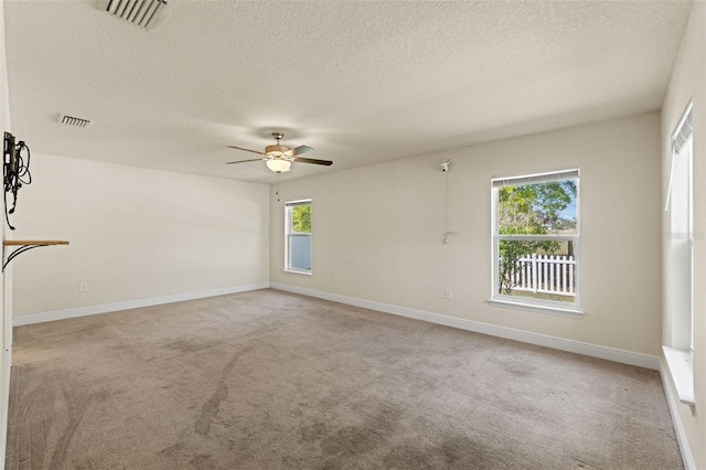 16302 Vine Cliff Ave, Hudson, FL 34667 - unfurnished room featuring light colored carpet, visible vents, ceiling fan, and baseboards