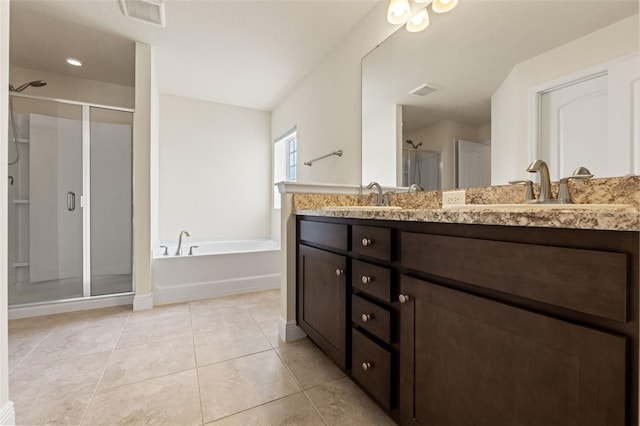 16302 Vine Cliff Ave, Hudson, FL 34667 - full bath featuring visible vents, a shower stall, double vanity, tile patterned floors, and a sink