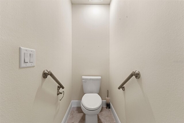 16302 Vine Cliff Ave, Hudson, FL 34667 - bathroom featuring baseboards, visible vents, toilet, and tile patterned flooring