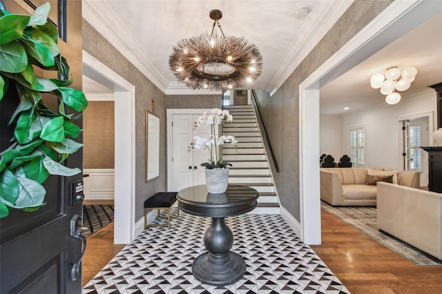 3313 W Mullen Ave, Tampa, FL 33609 - entrance foyer with stairs, crown molding, wood finished floors, and a chandelier