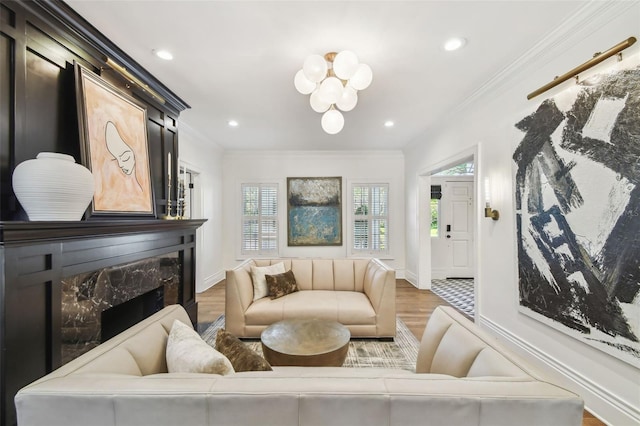 3313 W Mullen Ave, Tampa, FL 33609 - living room featuring ornamental molding, baseboards, a chandelier, a high end fireplace, and wood finished floors