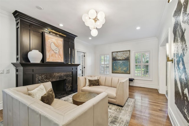 3313 W Mullen Ave, Tampa, FL 33609 - living area with crown molding, wood finished floors, a high end fireplace, baseboards, and recessed lighting