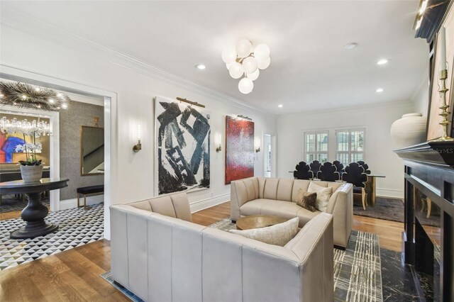 3313 W Mullen Ave, Tampa, FL 33609 - living area with crown molding, baseboards, a chandelier, and wood finished floors