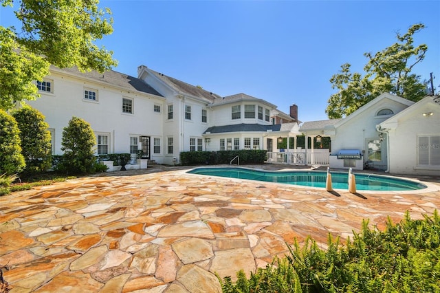 3313 W Mullen Ave, Tampa, FL 33609 - pool featuring a grill and a patio