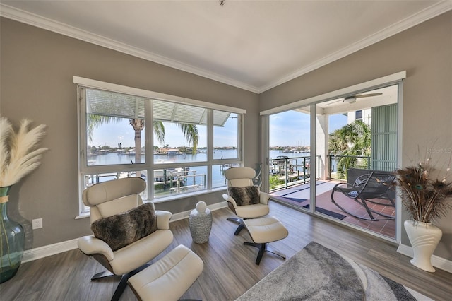 1038 Bellasol Way Unit 202, Apollo Beach, FL 33572 - living room featuring a water view, ornamental molding, wood finished floors, and a ceiling fan