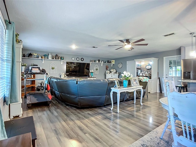 9616 Oak Ridge Ave, Riverview, FL 33578 - living room with visible vents, light wood-style floors, and a ceiling fan