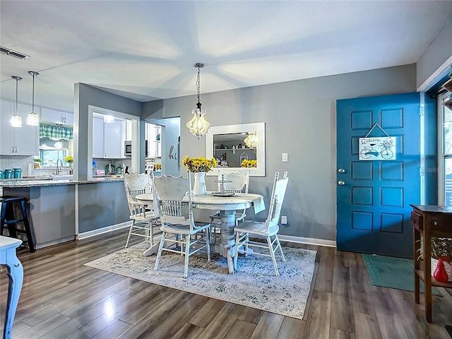 9616 Oak Ridge Ave, Riverview, FL 33578 - dining room with baseboards, visible vents, and dark wood-type flooring