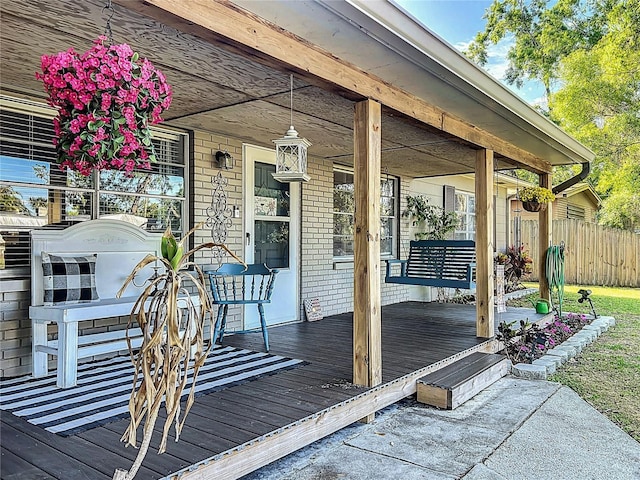 9616 Oak Ridge Ave, Riverview, FL 33578 - wooden deck featuring fence and a porch