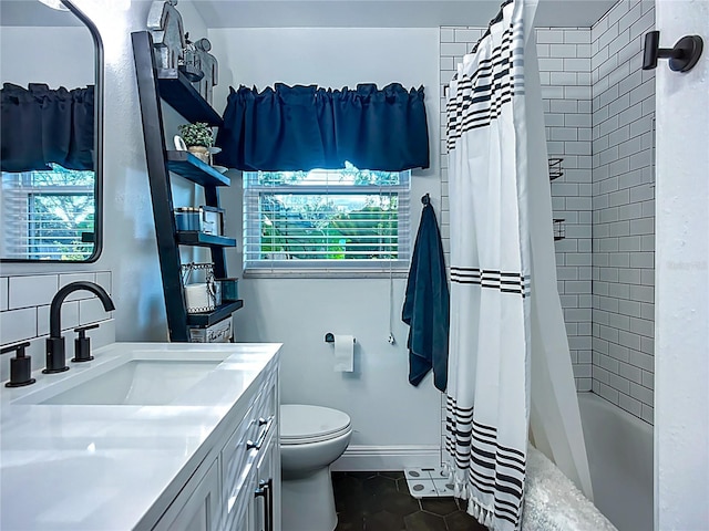 9616 Oak Ridge Ave, Riverview, FL 33578 - full bath with tile patterned flooring, vanity, toilet, baseboards, and shower / bath combo with shower curtain