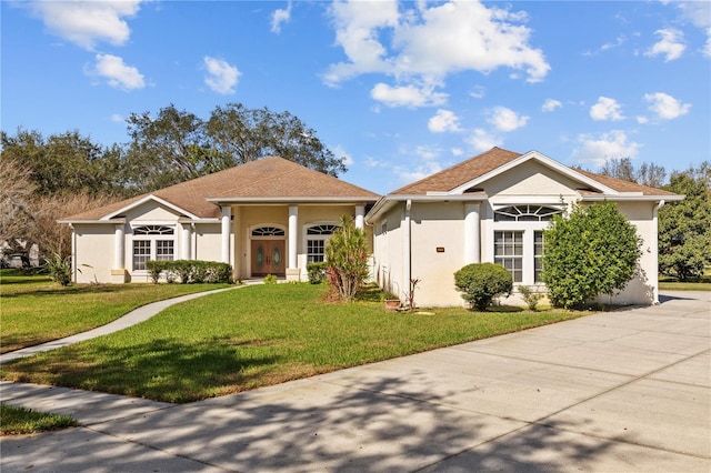 13750 Dowling Ln, Odessa, FL 33556 - view of front of house featuring a front lawn and stucco siding