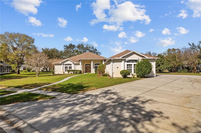 13750 Dowling Ln, Odessa, FL 33556 - single story home featuring a front lawn, stucco siding, and driveway