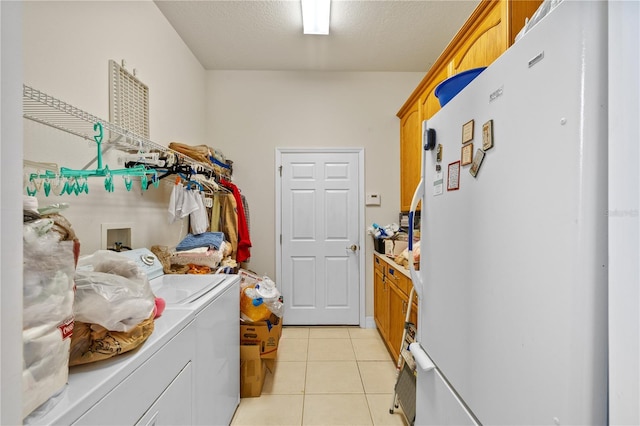 13750 Dowling Ln, Odessa, FL 33556 - laundry area with washer and clothes dryer, cabinet space, and light tile patterned floors
