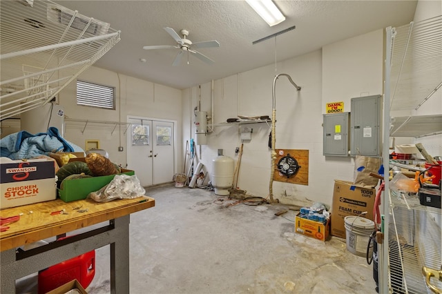 13750 Dowling Ln, Odessa, FL 33556 - miscellaneous room featuring concrete flooring, electric panel, and a ceiling fan