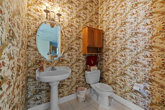 13750 Dowling Ln, Odessa, FL 33556 - half bath with wallpapered walls, tile patterned flooring, baseboards, toilet, and a chandelier