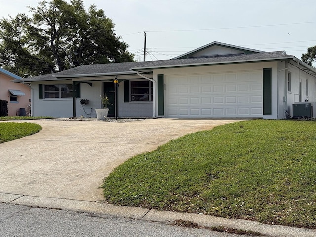 14264 Page Ave, Largo, FL 33774 - single story home featuring concrete driveway, stucco siding, an attached garage, a front yard, and central AC