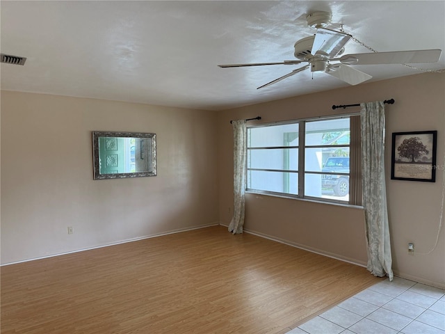 14264 Page Ave, Largo, FL 33774 - empty room featuring a ceiling fan, baseboards, light wood-style floors, and visible vents
