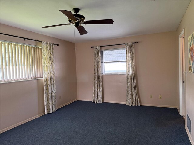 14264 Page Ave, Largo, FL 33774 - spare room with baseboards, ceiling fan, and carpet flooring