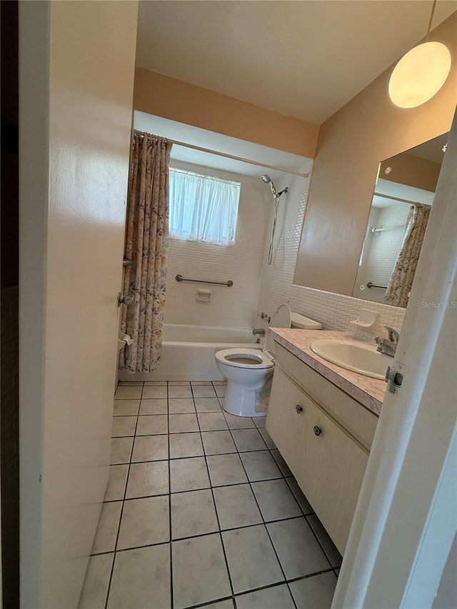 14264 Page Ave, Largo, FL 33774 - bathroom featuring tile patterned flooring, toilet, vanity, shower / bathtub combination with curtain, and backsplash
