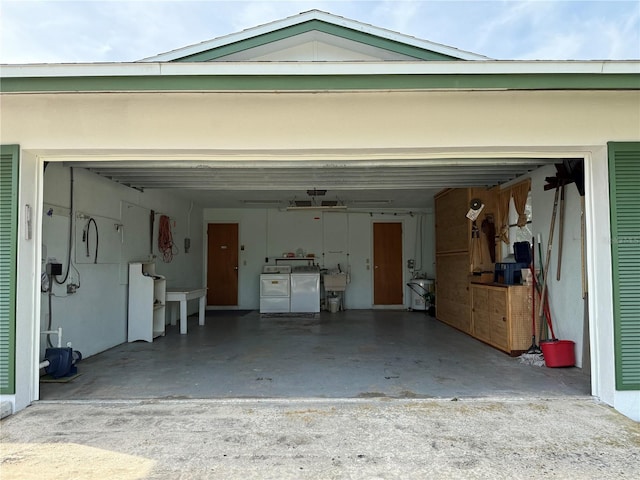 14264 Page Ave, Largo, FL 33774 - garage with separate washer and dryer and concrete driveway