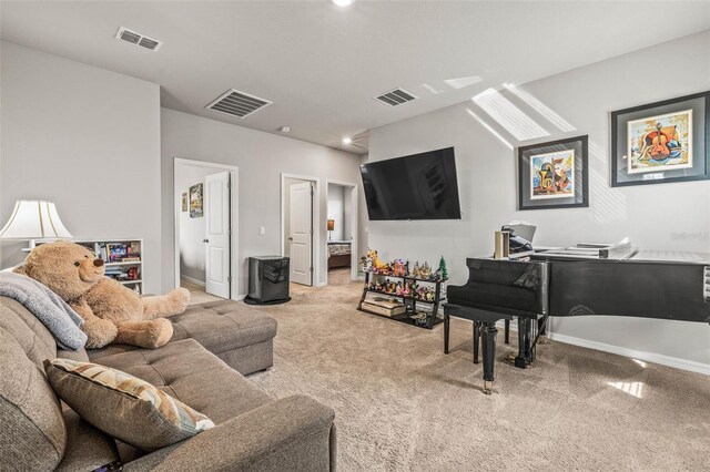 7334 Ashcroft Dr, Wesley Chapel, FL 33545 - living area with baseboards, light colored carpet, and visible vents