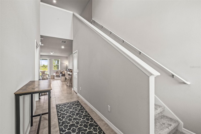 7334 Ashcroft Dr, Wesley Chapel, FL 33545 - staircase featuring baseboards, a high ceiling, visible vents, and recessed lighting