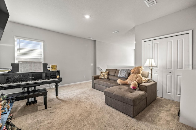 7334 Ashcroft Dr, Wesley Chapel, FL 33545 - carpeted living area featuring baseboards, visible vents, and recessed lighting