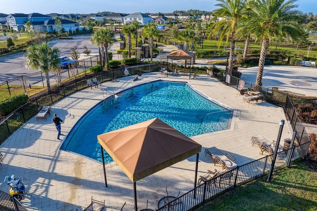 7334 Ashcroft Dr, Wesley Chapel, FL 33545 - community pool featuring a residential view, fence, and a patio