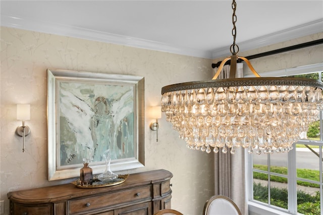 interior details featuring crown molding and an inviting chandelier