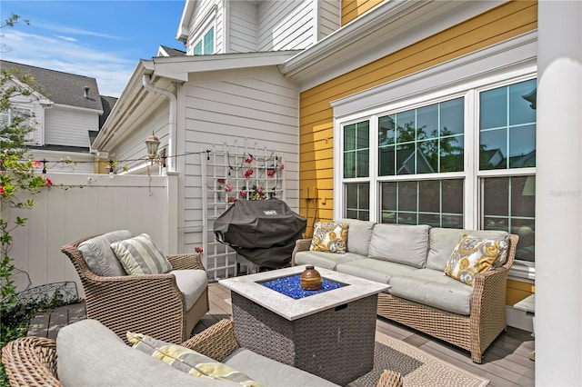 view of patio with area for grilling, an outdoor hangout area, and fence