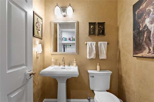 half bathroom with toilet