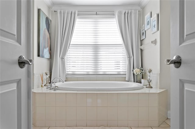 bathroom with a garden tub and crown molding