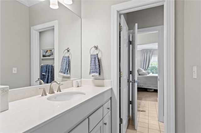 bathroom featuring tile patterned floors, vanity, and ensuite bathroom