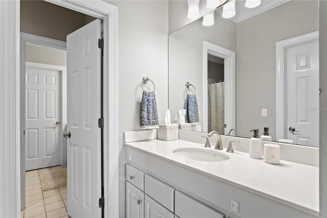 bathroom featuring tile patterned flooring and vanity