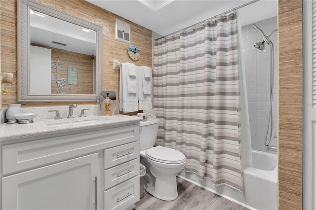 200 120th Ave W Unit 3A, Treasure Island, FL 33706 - full bath with toilet, vanity, shower / tub combo, wood finished floors, and wood walls