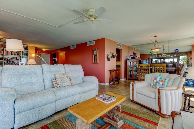 80 Rogers St Unit 2A, Clearwater, FL 33756 - living area with baseboards, visible vents, and a ceiling fan