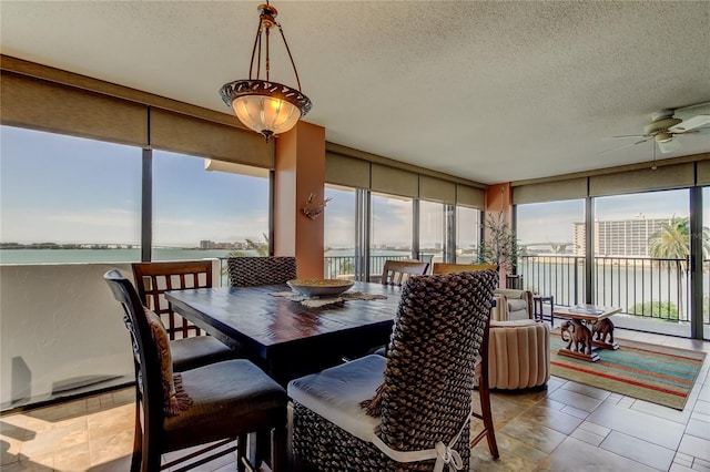 80 Rogers St Unit 2A, Clearwater, FL 33756 - sunroom featuring floor to ceiling windows and a textured ceiling